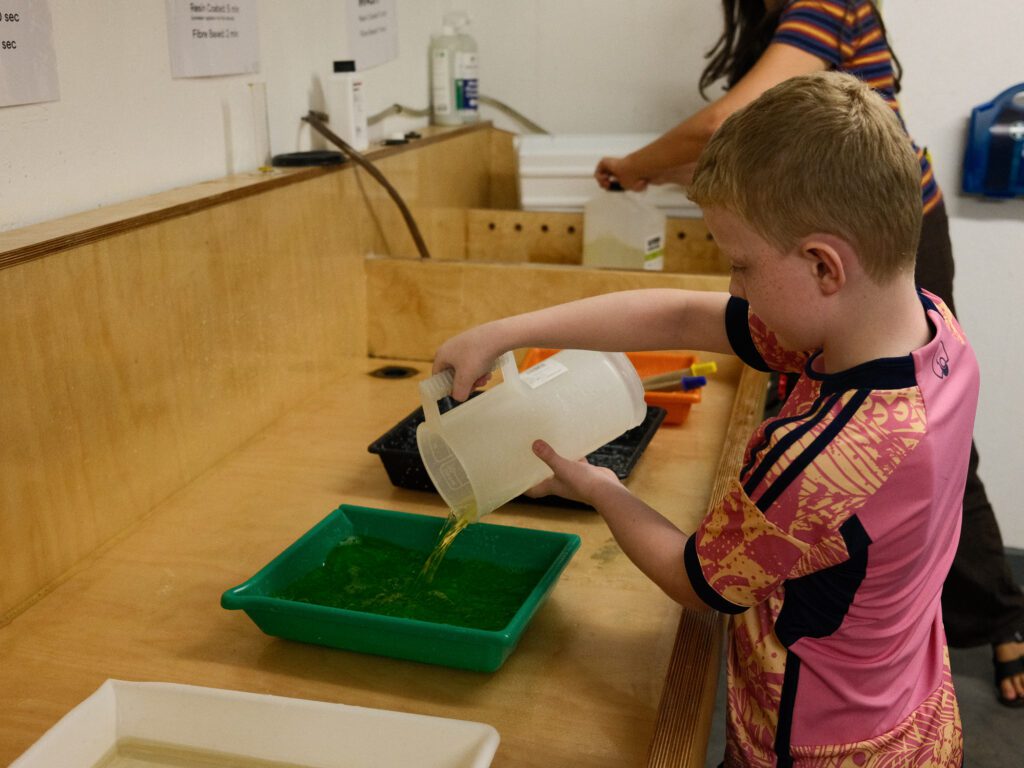 Emily got Ellis to work, getting him to work out and measure the correct ratios of chemicals