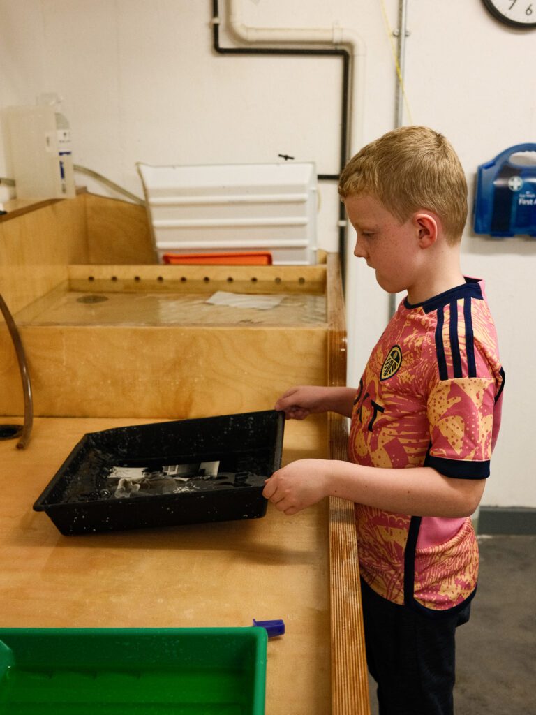 Ellis fixing his print in the darkroom
