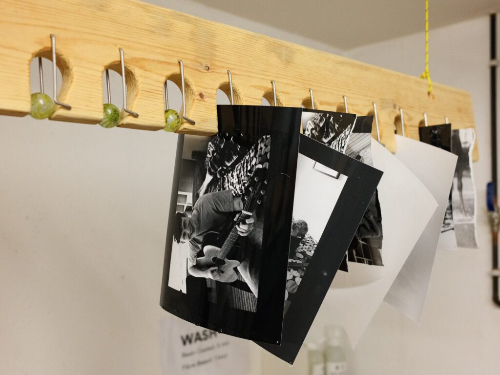 Our finished prints hanging to dry in the darkroom